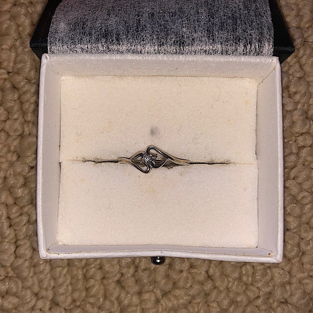 Two hearts one diamond ring.